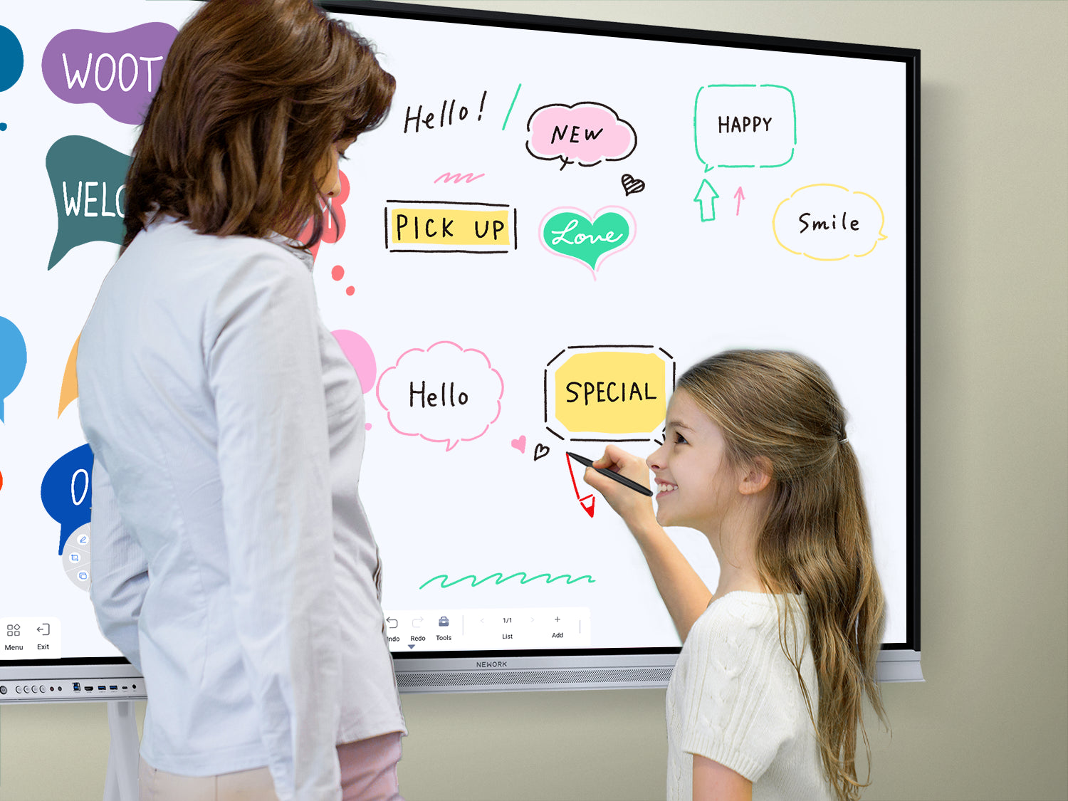 Teacher and elementary student writing on a smart board to boost engagement in a K-12 interactive classroom